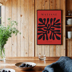 Matisse Art Prints - Black Abstract Coral Shape Red Poster framed in a modern setting with furnishings and decor.