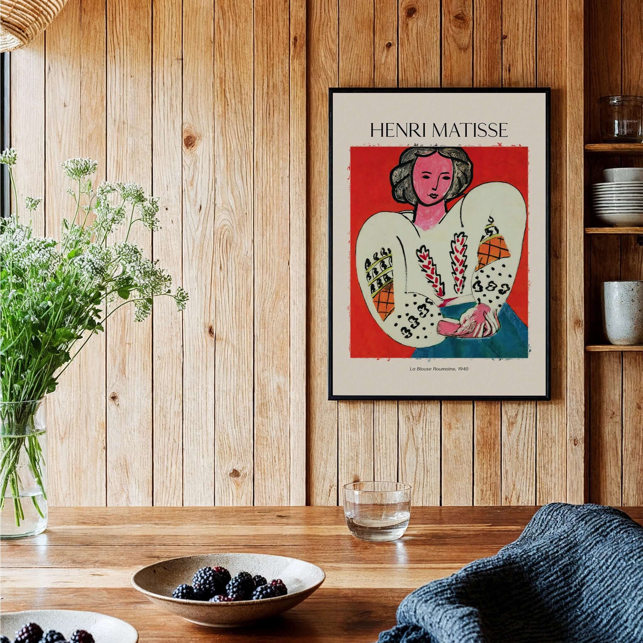 Matisse Poster - La Blouse Roumaine 1940 Famous Art Print displayed in a cozy interior setting with a wooden table and plants.