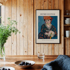 Matisse Art Print - Madras Rouge Red Headdress 1907 Wall Art Poster displayed in a rustic interior setting.
