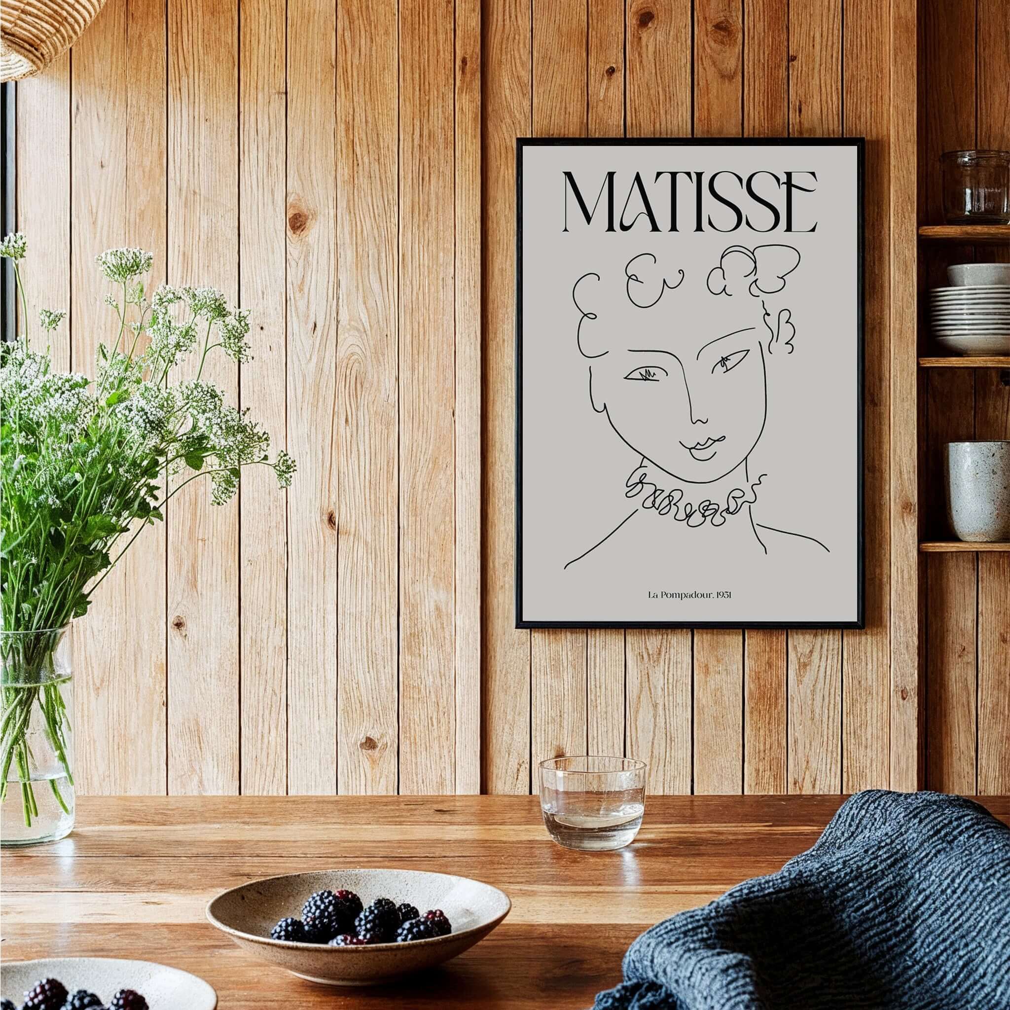 Matisse Art Print La Pompadour 1951 Minimalist Line Drawing Poster displayed in a cozy interior with plants and tableware.