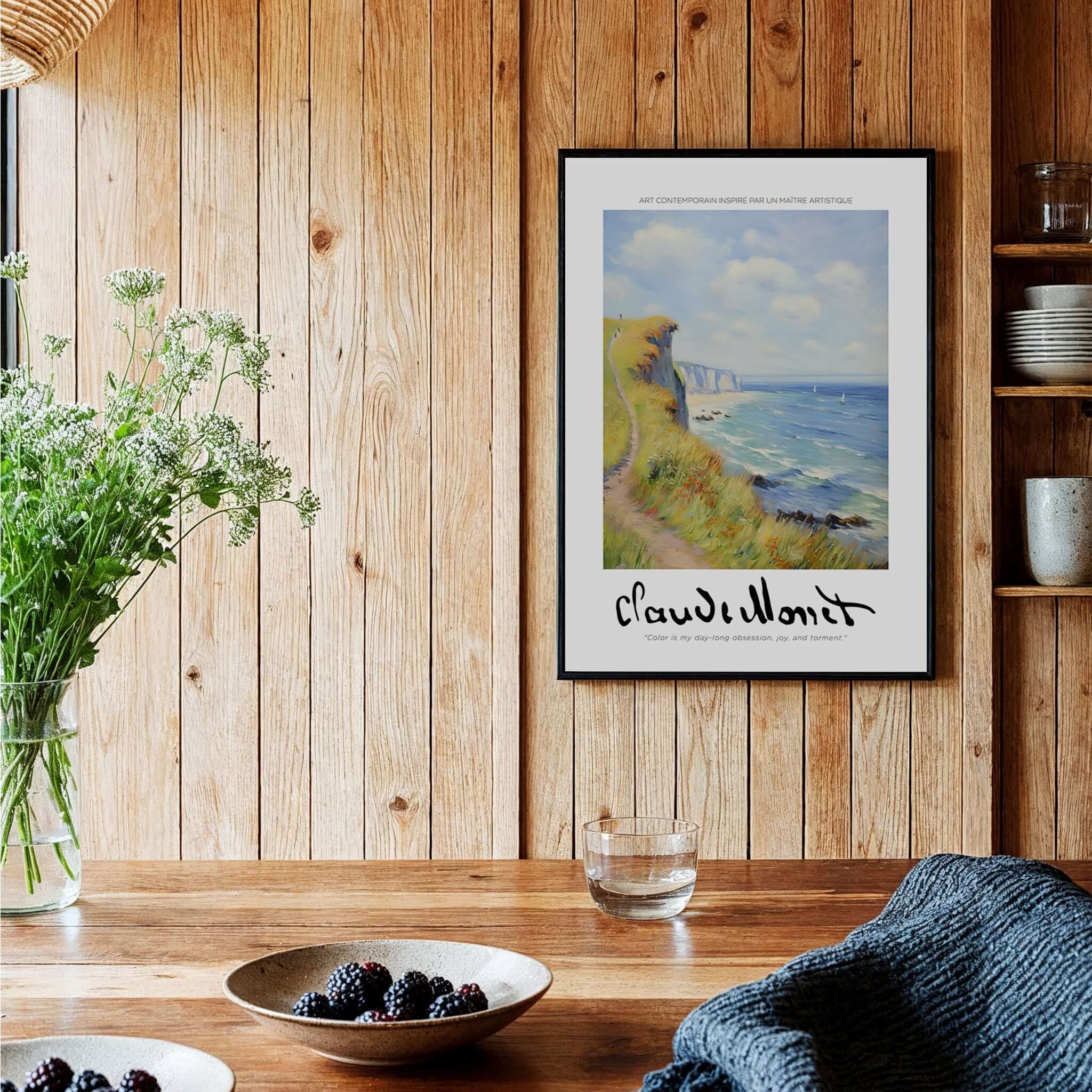Claude Monet Art Print - Coastal Cliff Path Seascape Wall Art framed on a wooden wall with coastal scenery.