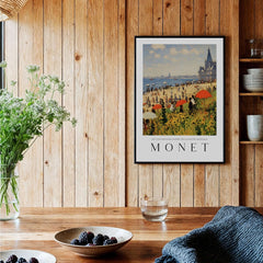 Claude Monet Art Print - Sunny Beach Resort with Flowers Poster hanging in a wooden kitchen setting with flowers.