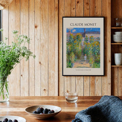 Monet Artists Garden at Vétheuil Sunflowers Impressionist Art Print Poster displayed in a cozy room with wooden decor.