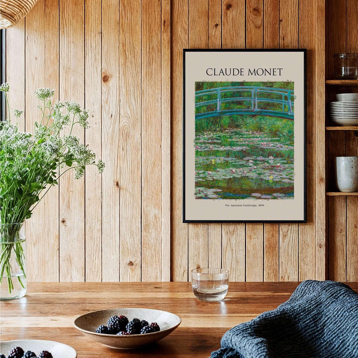 Monet Japanese Footbridge Water Lilies Giverny Garden Poster Art Print displayed in a cozy interior setting.