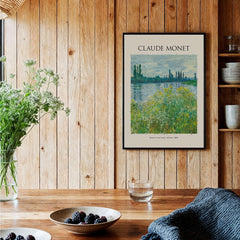 Monet Banks of the Seine Vétheuil River Landscape Art Print Poster displayed in a cozy wooden interior setting.