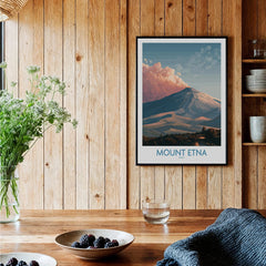 Framed Mount Etna travel poster on wood wall in cozy kitchen setting with berries on table