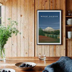 Mount Rainier art print in black frame on wood wall in rustic kitchen with bowls and flowers