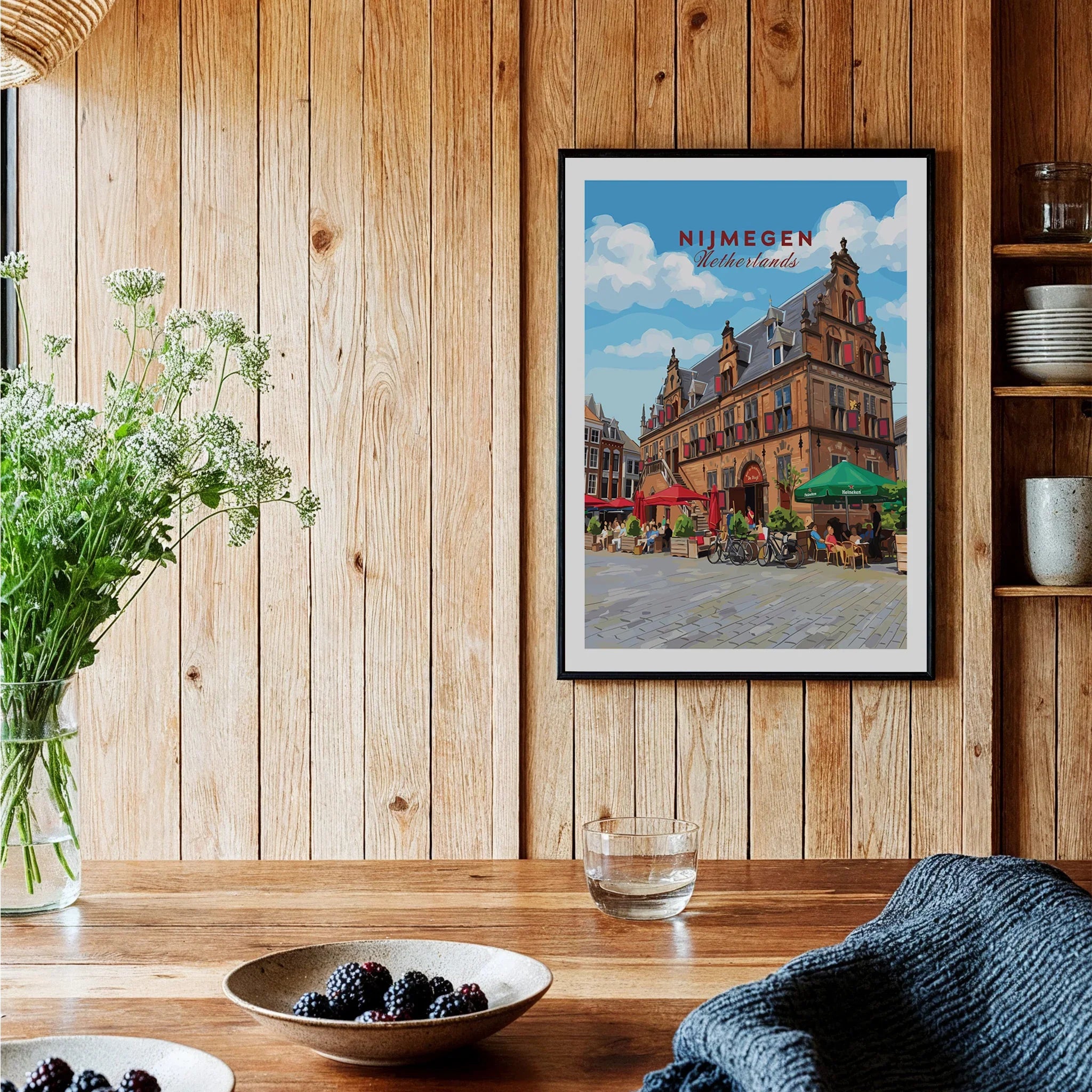 Nijmegen Netherlands travel poster in black frame on rustic kitchen wall with wood paneling