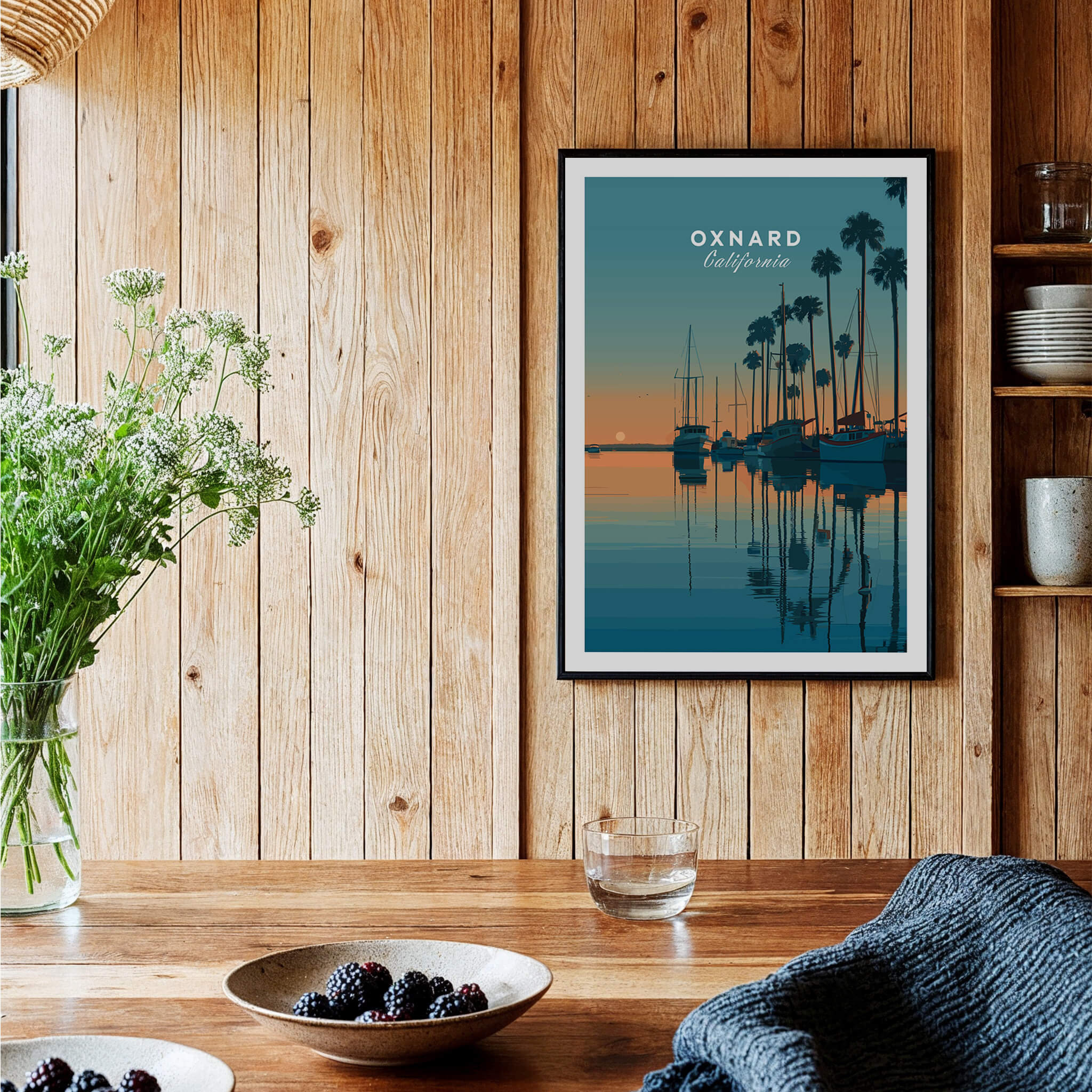 Oxnard California Wall Art Print | Sunset Harbor & Sailboats Travel Poster displayed in a cozy interior with wooden walls.
