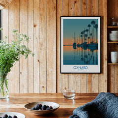 Oxnard California Poster | Scenic Pacific Marina Canvas Print displayed in a cozy wooden-themed interior with plants.
