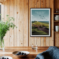 Peak District National Park art print in black frame on wooden kitchen wall, rustic decor