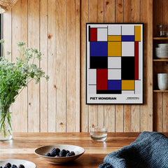 Piet Mondrian Composition A Geometric Abstract Art Print De Stijl Poster Wall Decor displayed in a cozy interior setting.