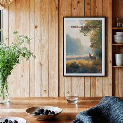 Richmond Park art print in black frame hanging in rustic kitchen with wooden walls and fresh berries on table.