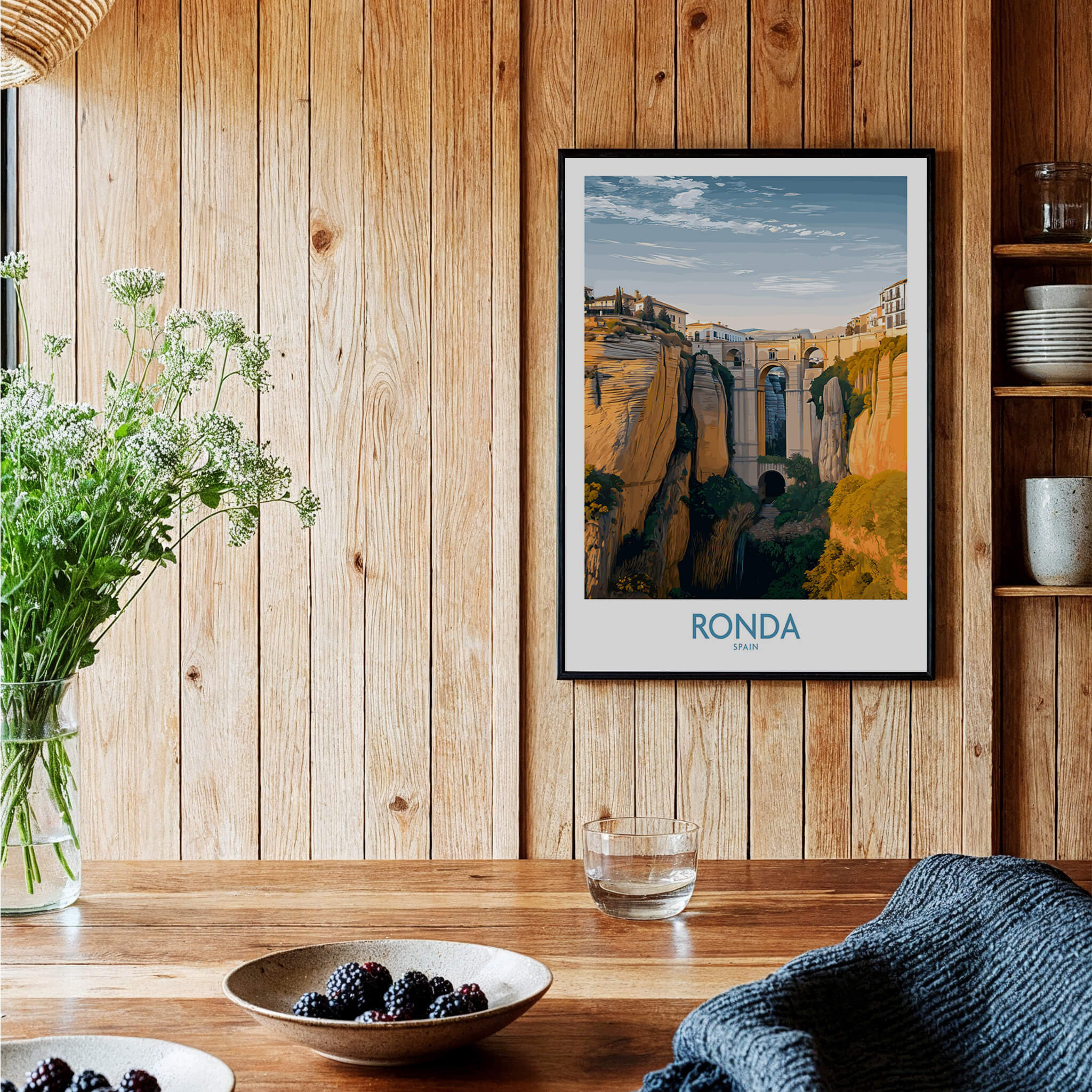 Ronda Spain Poster | Iconic Stone Bridge & Valley View Canvas Print displayed in a cozy, rustic kitchen setting.