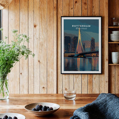 Rotterdam city skyline art print in black frame displayed in a cozy wooden kitchen setting.