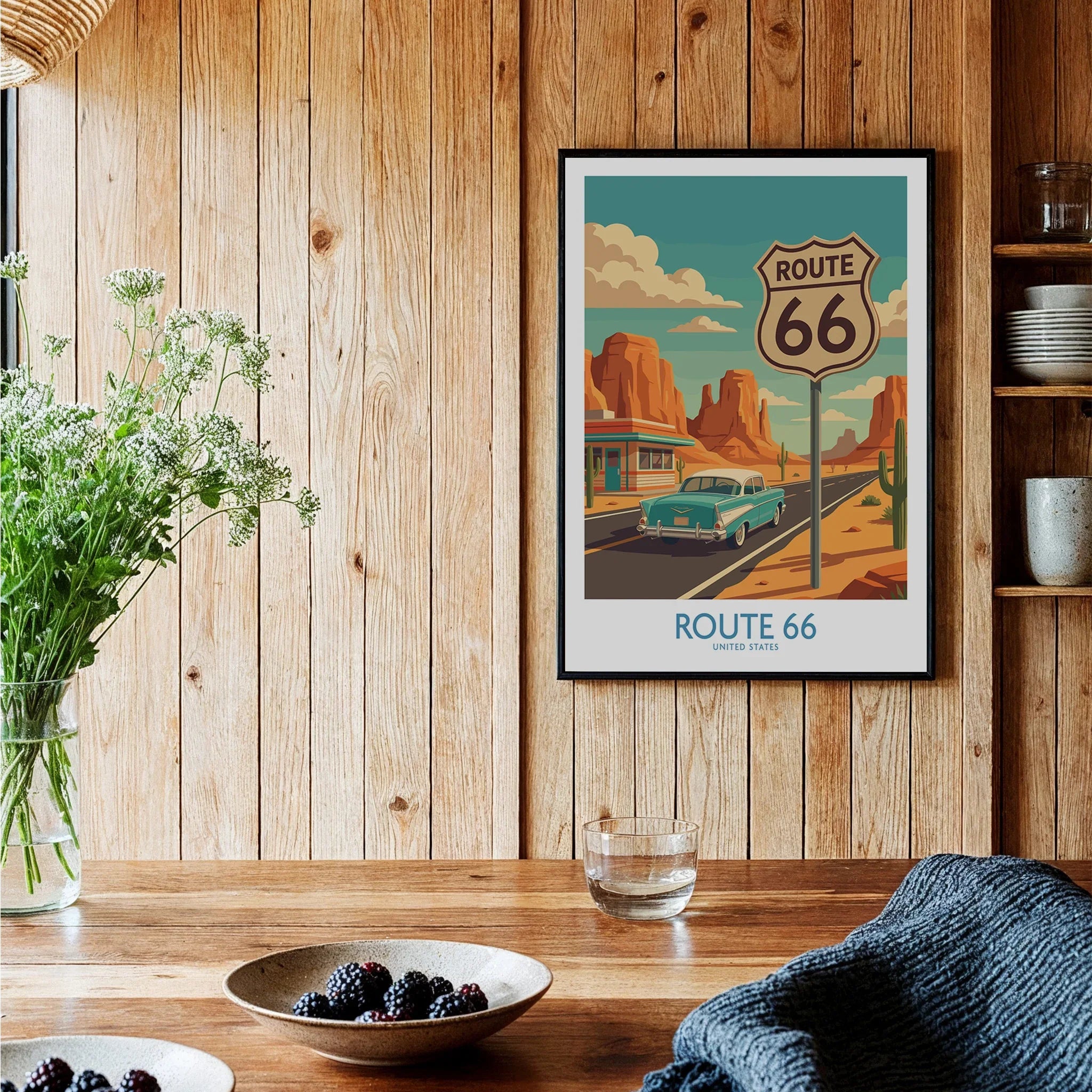 Framed Route 66 travel poster art print on wood wall in cozy kitchen setting