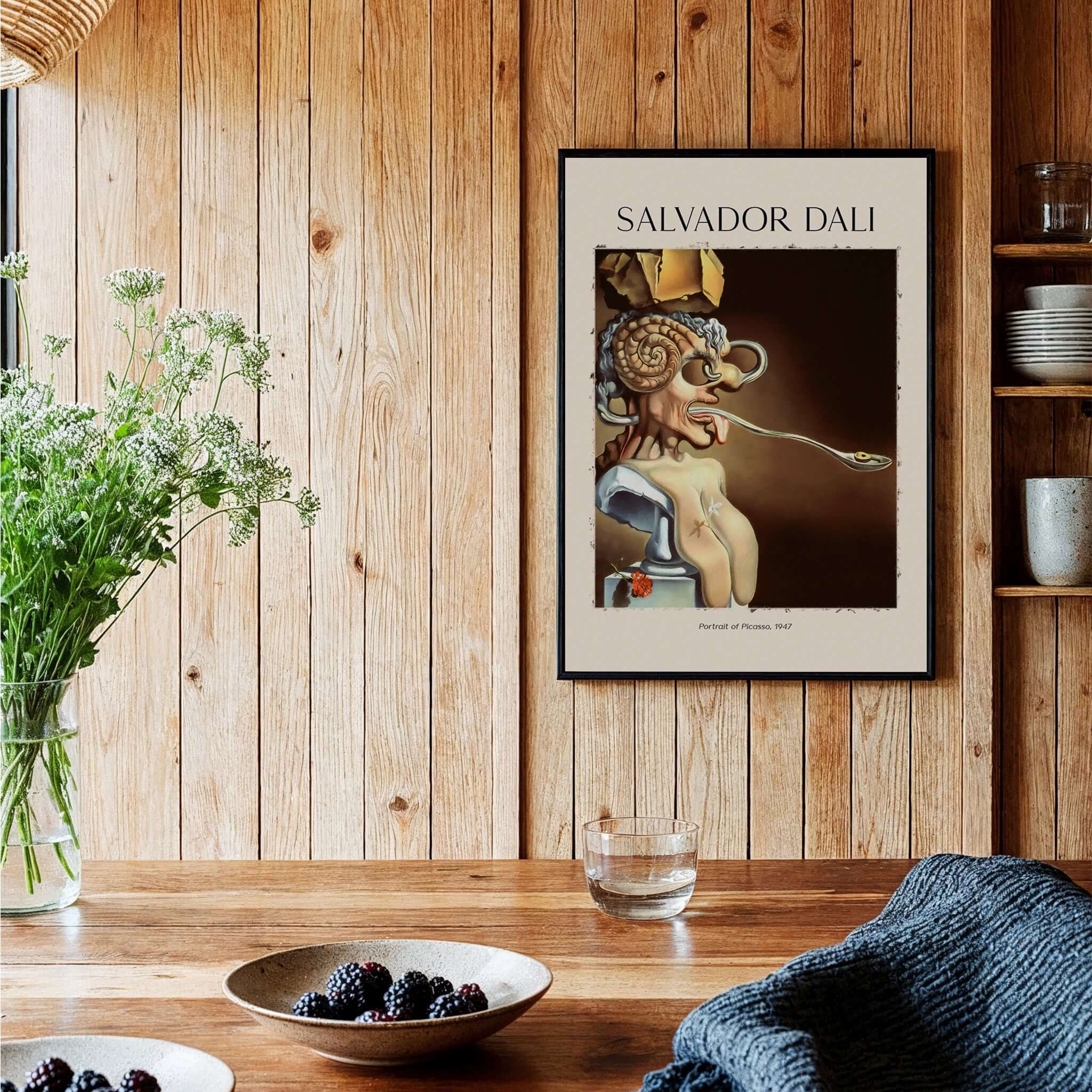 Salvador Dali Portrait of Picasso 1947 Surrealist Art Print Grotesque Poster displayed on a wooden wall.