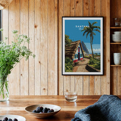 Framed Santana Madeira travel poster on wood wall in cozy kitchen setting