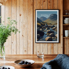 Scafell Pike Poster Lake District Wall Art Print displayed in a wooden interior setting with decorative plants and bowls.