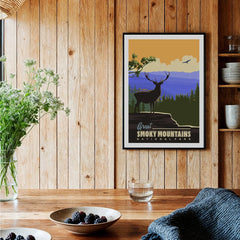 Framed Smoky Mountains National Park art print in rustic kitchen with wood panel wall.