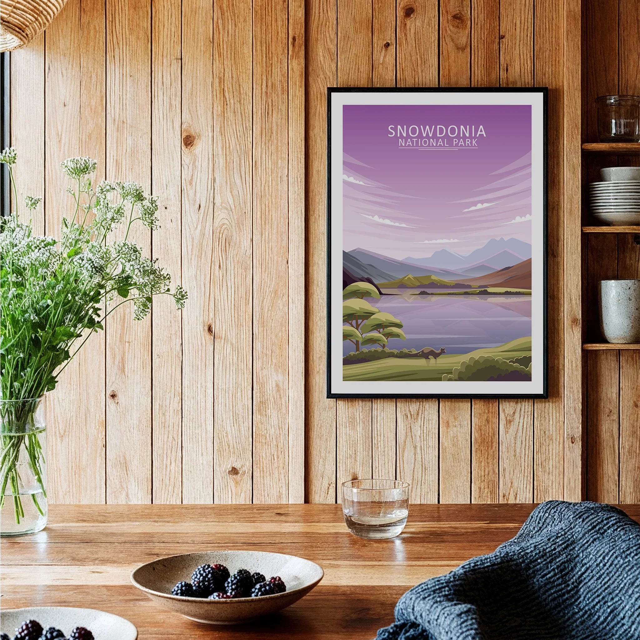 Snowdonia National Park travel poster in black frame on rustic wooden kitchen wall