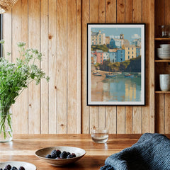 Tenby travel poster art print in black frame displayed in rustic kitchen setting