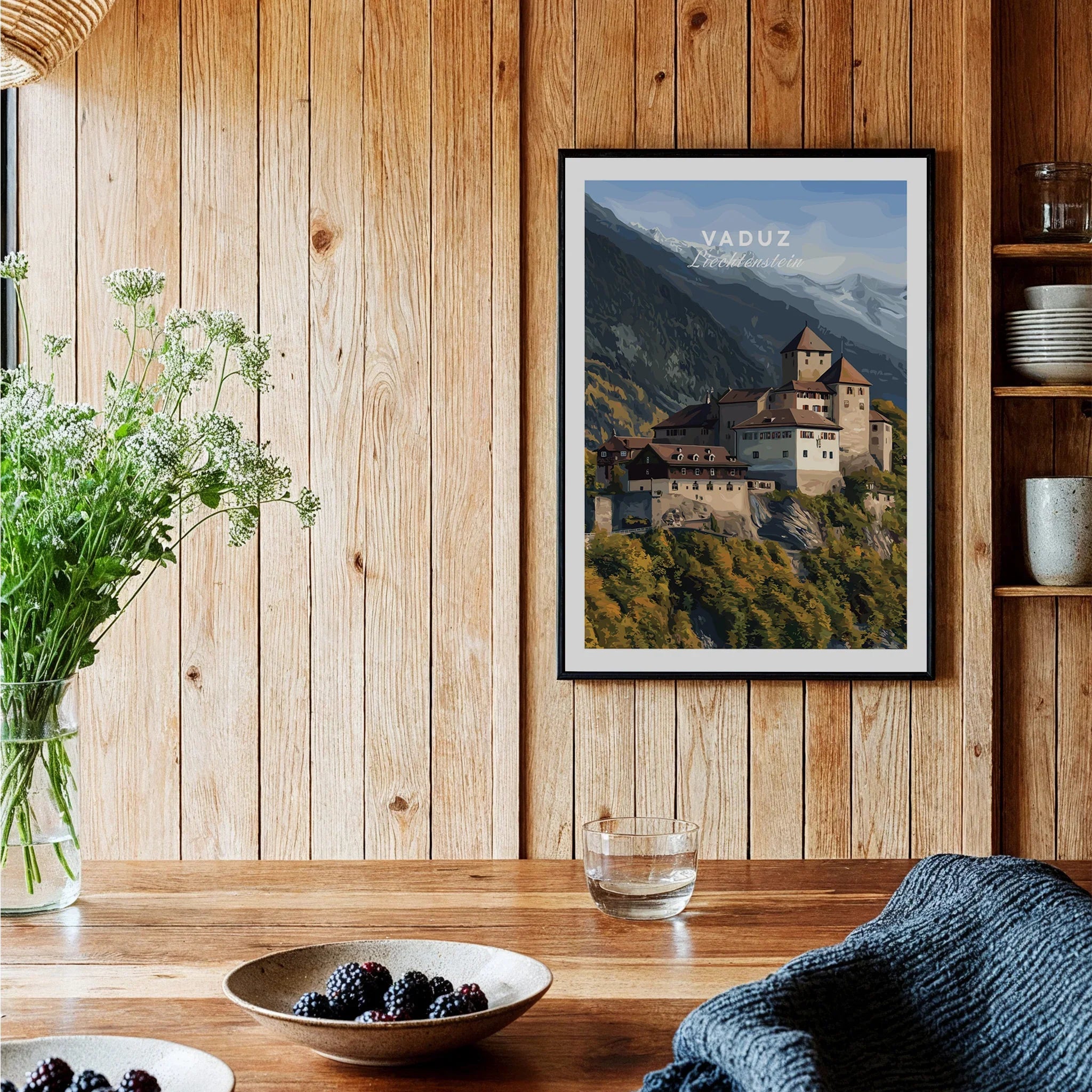 Framed Vaduz travel poster wall art in cozy wood kitchen setting with natural decor