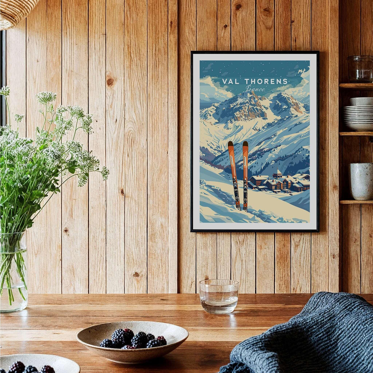 Val Thorens Travel Poster showcasing ski scenery and mountains in a cozy interior setting.