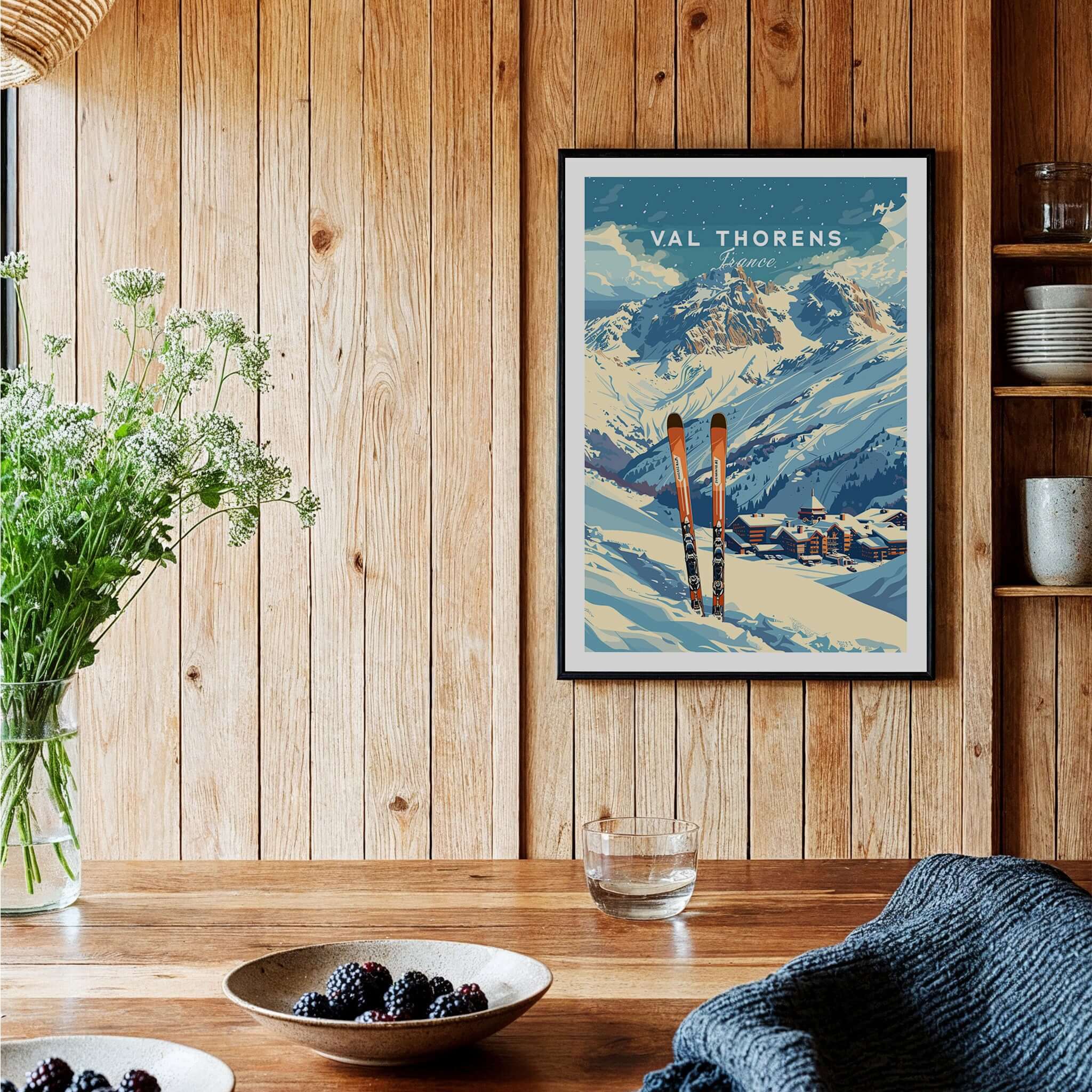 Val Thorens Travel Poster showcasing ski scenery and mountains in a cozy interior setting.