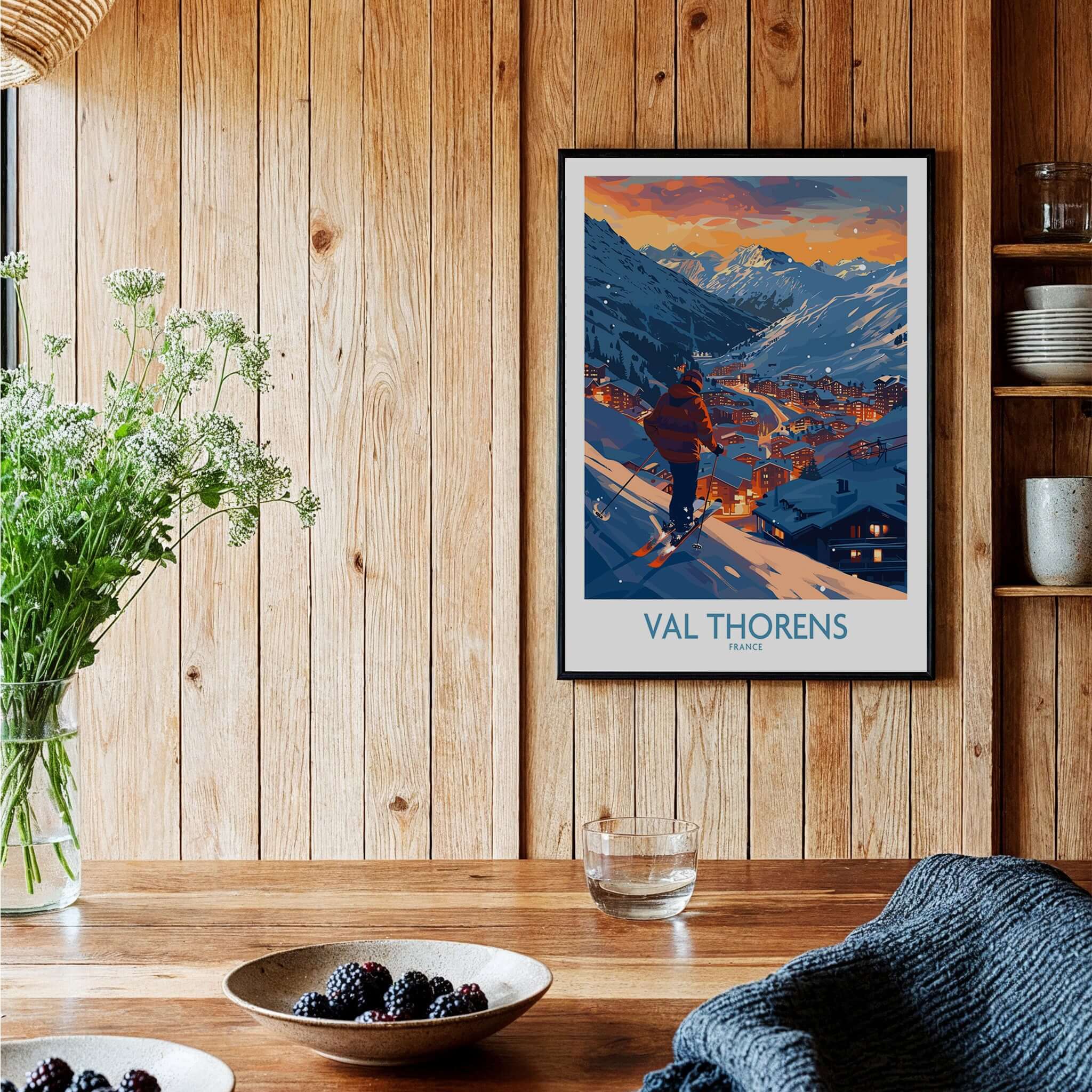 Val Thorens Ski Print framed poster showcasing the ski resort at sunset in a cozy interior setting.