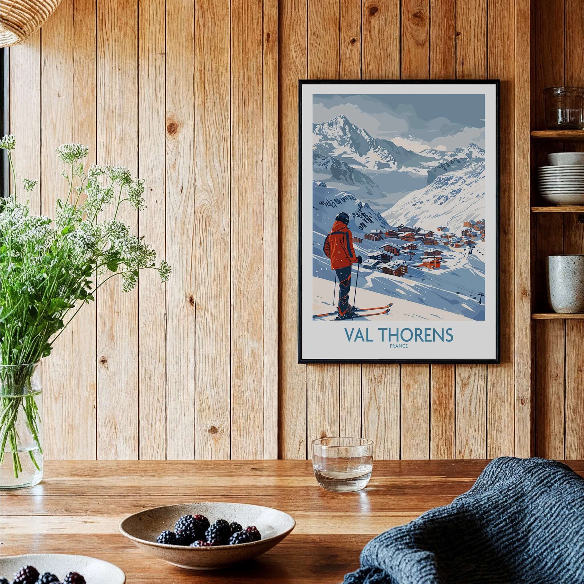 Val Thorens France Print showcasing a skier against a stunning mountain backdrop in a cozy home setting.