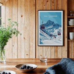 Val Thorens Ski Art Print | Winter Sports French Alps displayed in a cozy wooden interior with a mountain backdrop.