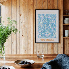 Yayoi Kusama Blue Infinity Net Pattern Abstract Art Print Paris Exhibition Poster framed on wooden wall with decor.