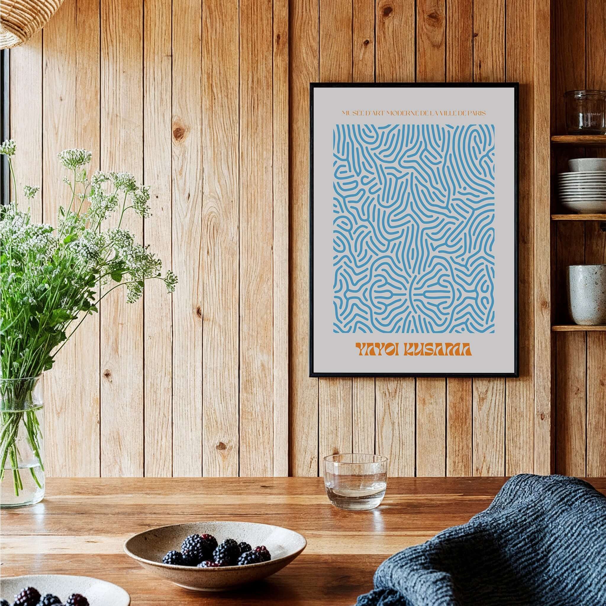 Yayoi Kusama Blue Infinity Net Pattern Abstract Art Print Paris Exhibition Poster framed on wooden wall with decor.