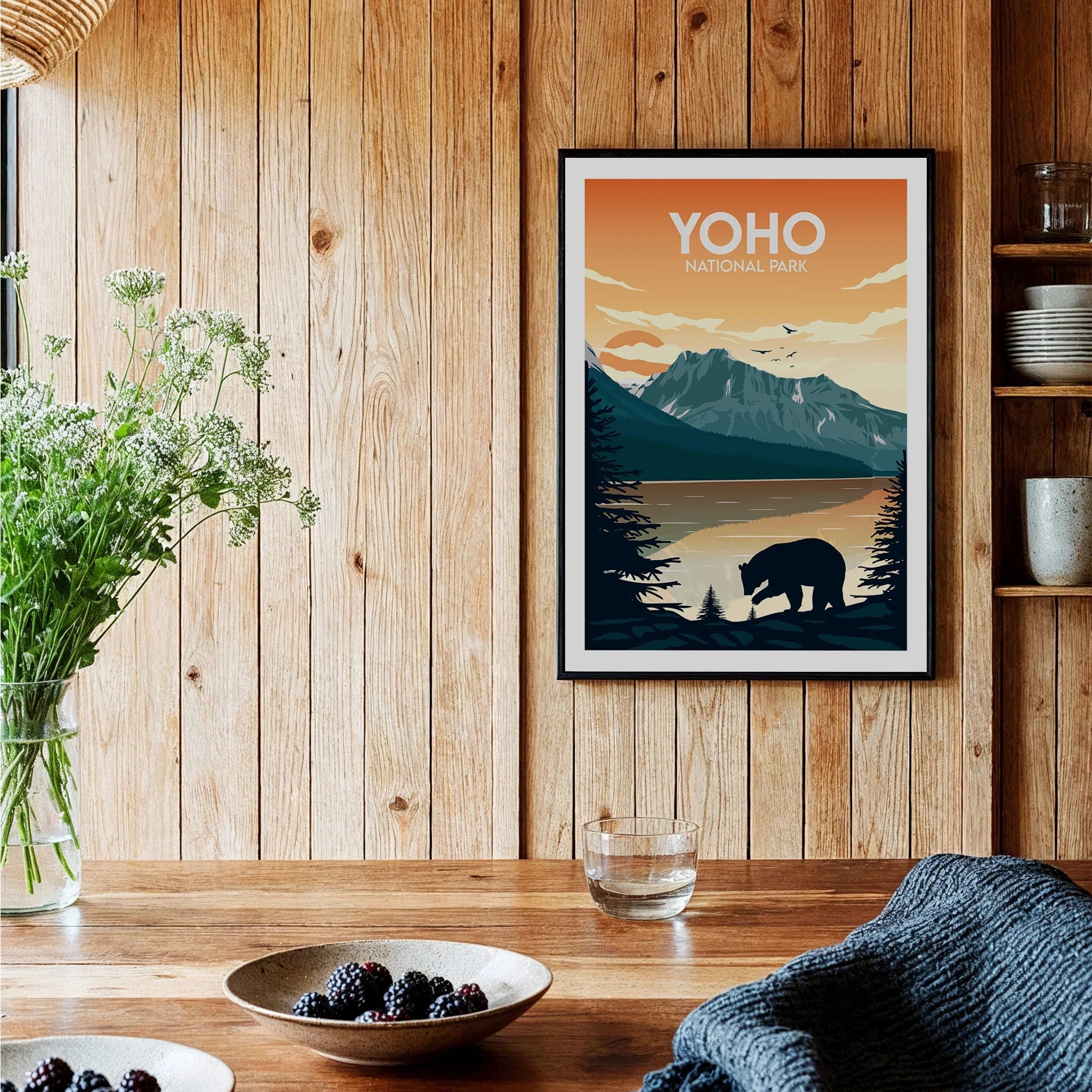 Framed Yoho National Park art print with bear and mountain in cozy wooden kitchen