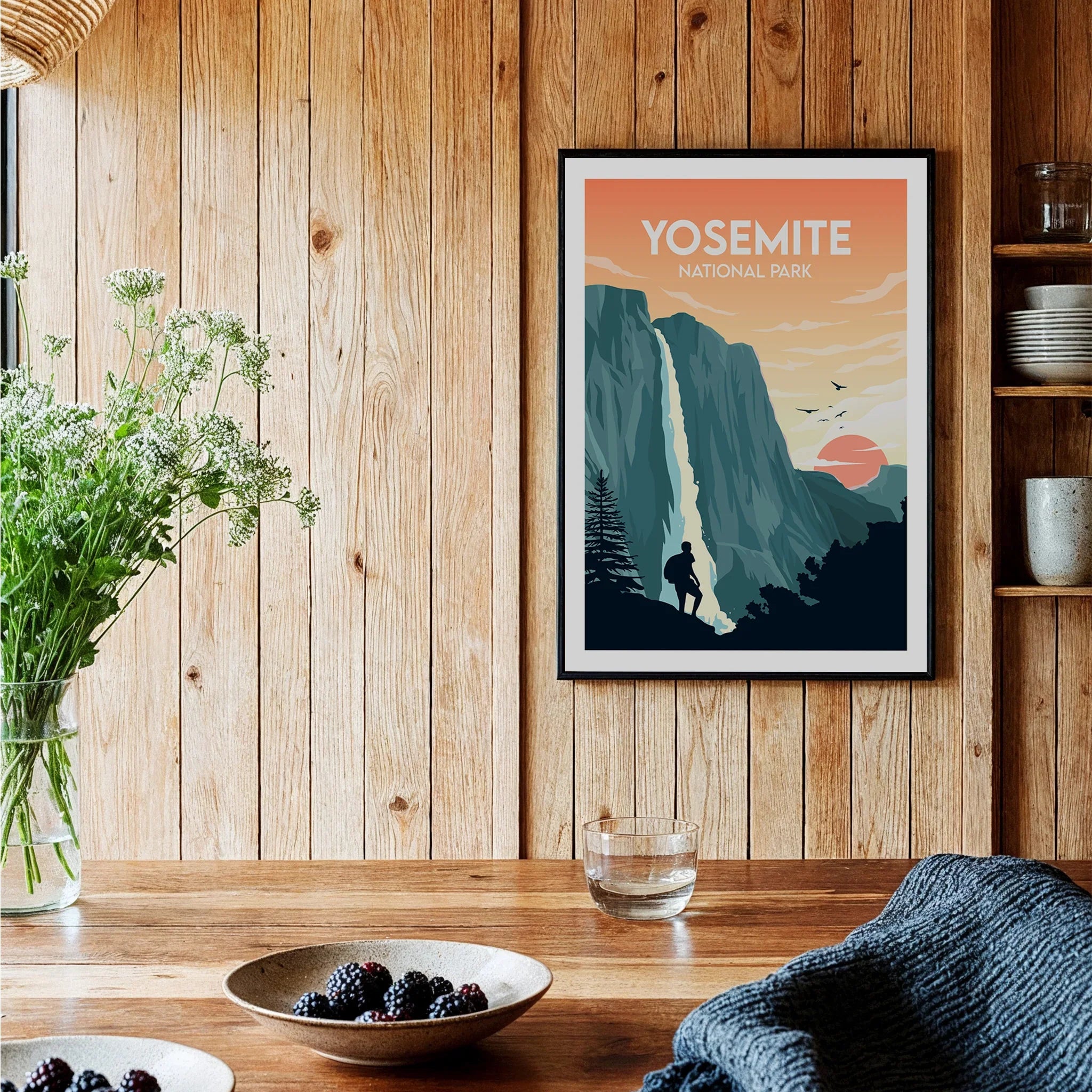 Yosemite National Park art print on wooden kitchen wall, bowls of fruit on table