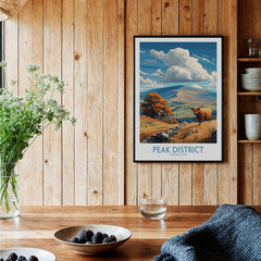 Peak District National Park Highland Cow Art Print | Derbyshire Landscape Poster displayed in a cozy interior setting.