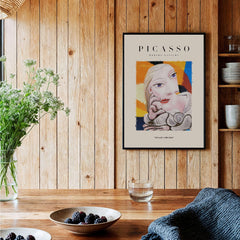 Picasso Blonde Woman Abstract Portrait Print Cubist Style Poster Artwork Collection displayed on a wooden wall.