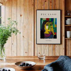 Picasso Contemplative Woman Abstract Art Print Colorful Portrait Poster Artwork Collection displayed in a wooden interior.