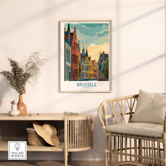 Brussels Belgium Travel Poster framed on a wall above a stylish chair, showcasing vibrant city architecture.