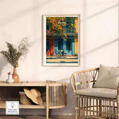 Hanoi Vietnam Print - Vibrant Hanoi Wall Art featuring a cyclist against colorful buildings in a cozy setting.