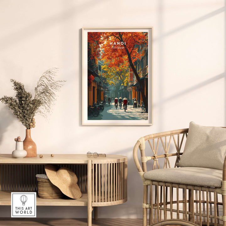 Hanoi poster with vibrant autumn colors, depicting city street life, framed and displayed in a cozy room setting.