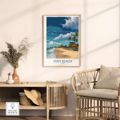 Vero Beach Sunny Beach Umbrellas and Sun Loungers Poster - Florida Vacation Decor framed on the wall above a rattan chair.