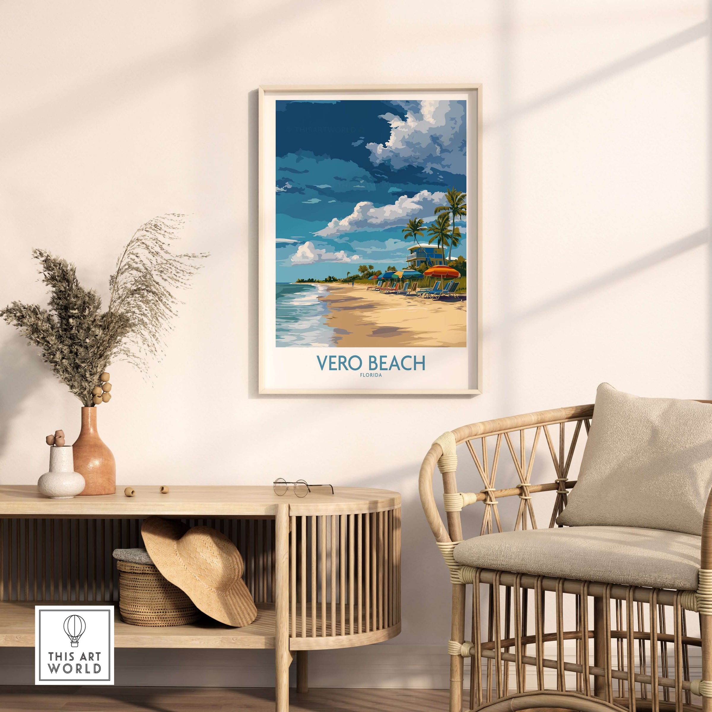 Vero Beach Sunny Beach Umbrellas and Sun Loungers Poster - Florida Vacation Decor framed on the wall above a rattan chair.