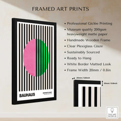 Bauhaus Exhibition Prints - Split Circle Abstract Art Print Pink Green Stripes in a framed display with black stripes.
