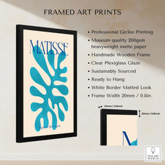 Matisse Cyan Blue Abstract Shape Papiers Découpés Poster framed with black wooden frame and plexiglass on beige background.