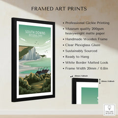 Framed South Downs National Park print with coastal cliffs, cottage, and lush greenery.