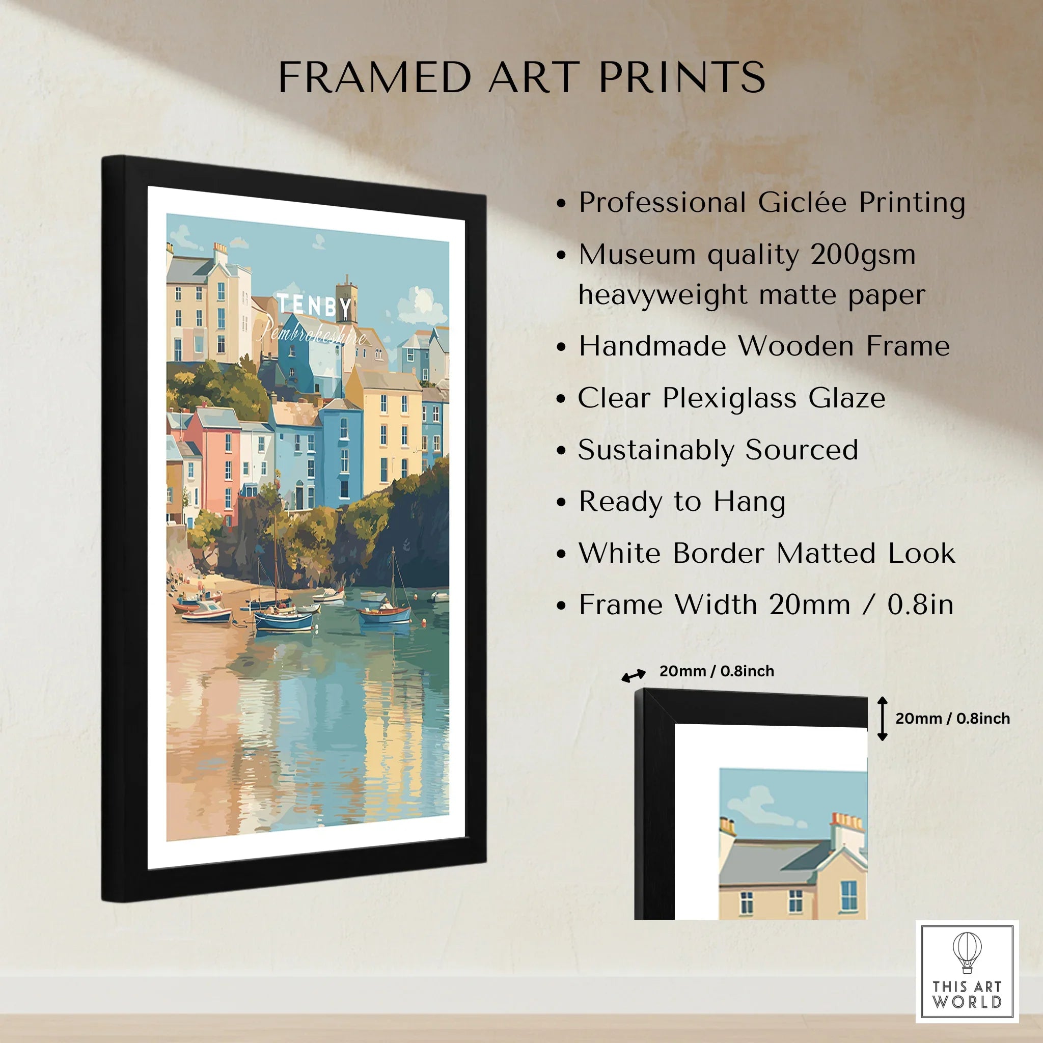 Framed Tenby travel poster print with colorful coastal houses, wooden frame, and size details