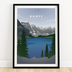Banff National Park art print with blue lake, mountain landscape, and pine trees in black frame