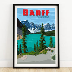 Banff National Park art print with turquoise lake, pine trees, and snowy mountains in black frame